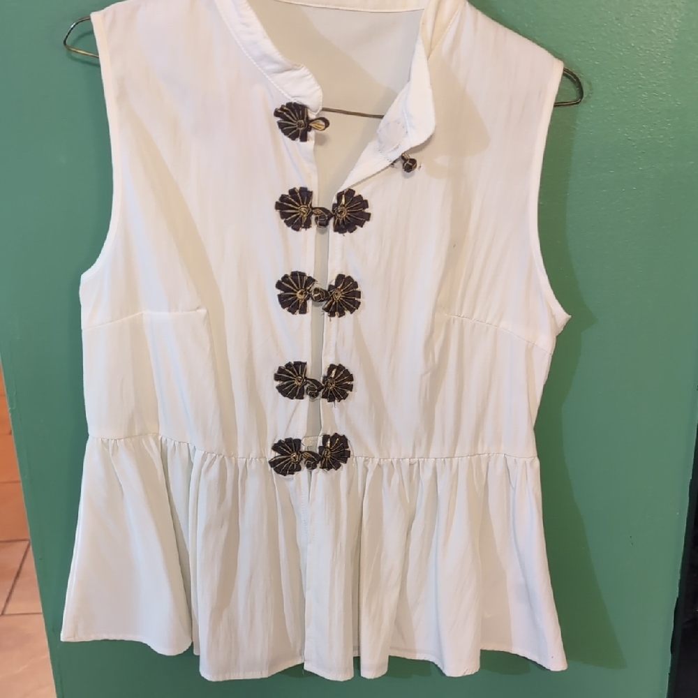 Sleeveless White Top with Black Accents